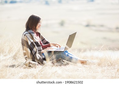 Woman Woking Outdoors. Remote Work On Camping. Female Typing On Pc.