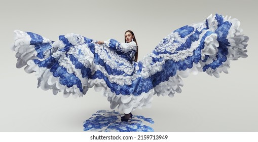 Woman in wonderful flying dress with blue and white waves. Drawing and ruffles on clothes. Model standing on the blue waves drawing                                 - Powered by Shutterstock
