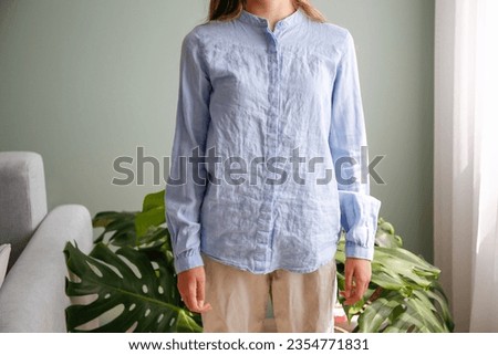 The woman wore a rumpled shirt.