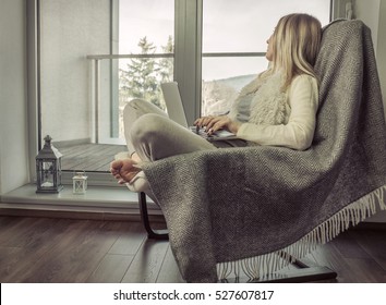 Woman Work At Laptop And Relax On Vintage Sofa At Home Near The Window. Interior Decoration In Living Room 