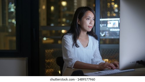 Woman work on computer at night - Powered by Shutterstock