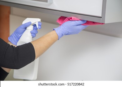 Woman at work, professional maid cleaning in dental office