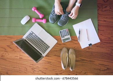 Woman Work And Workout At Home For Healthy Concept And Work Life Balance.  With Laptop And Workout Equipments. Top View.