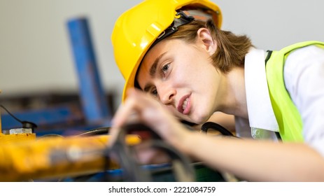 Woman worker checking machine system for metal sheet factory, construction, logistic, business in workplace area. Metal sheet industrial manufacturing factory. Factory woker in warehouse.
