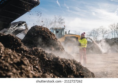 Woman Worker With Clipboard In Industrial Compost Plant