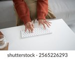 Beautiful asian Woman working by using wireless bluetooth white keyboard computer Hands typing on keyboard.  Technology business Concept.