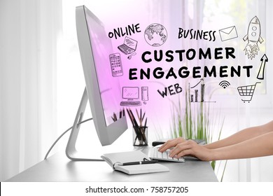 Woman working with computer at table. Concept of customer engagement
