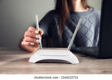 Woman Working In Computer With Wifi Router On Table