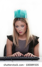 Woman Working At Her Desk Wearing A Christmas Hat From A Cracker Not Looking To Happy