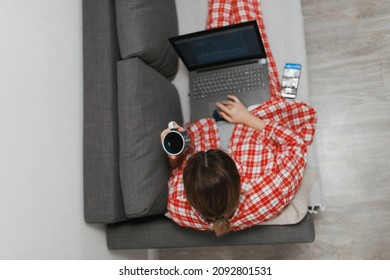 Woman Working From Home During Pandemia, Talking On The Phone And Drinking Coffee
