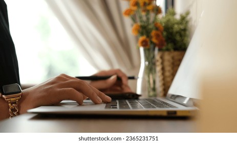 Woman working at home office hand on keyboard close up. - Shutterstock ID 2365231751
