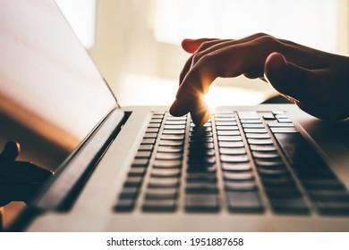 Woman working at home office.Close up hand on laptop keyboard.