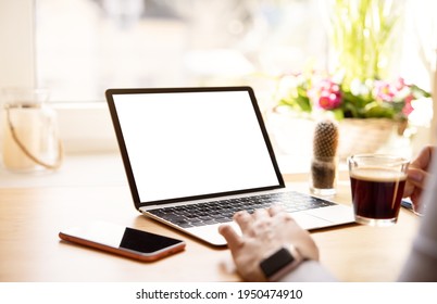 Woman working with laptop computer, mockup with empty blank screen