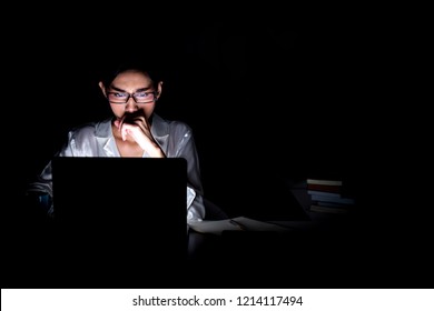 Woman Working Late At Her Home Office. Beautiful Asian Woman Working On Her Computer, Full Focus, Wearing Glasses. Modern Global Connected Business Concept.