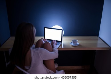 Woman Working Late At Night At Home.