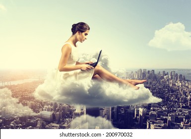 Woman working o a cloud above the city