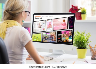 Woman working in office and viewing sample creative agency's website on computer screen - Powered by Shutterstock