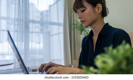 woman working on a computer - Shutterstock ID 2193033403