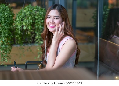 Woman Working On The Ipad Computer At Garden