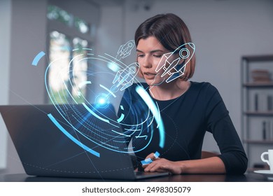 Woman working on a laptop with futuristic holographic interface in modern office setting, concept of technology and innovation - Powered by Shutterstock