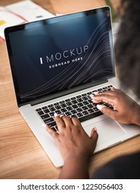 Woman Working On A Laptop Screen Mockup