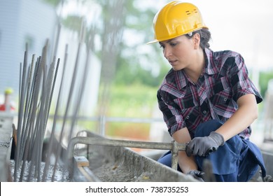 woman working on metal structure