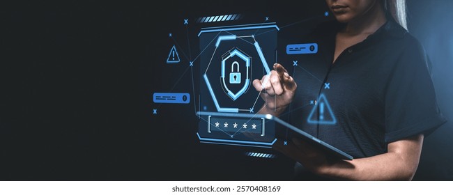 Woman working on a tablet, interacting with a glowing cyber security hologram, on a dark background, concept of online data protection