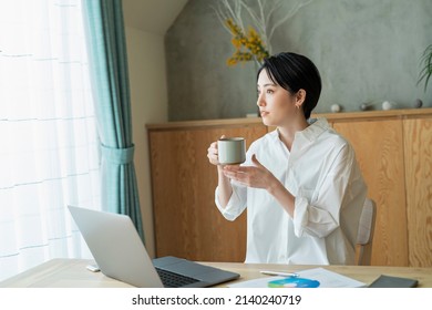 Woman Working Remotely With Coffee