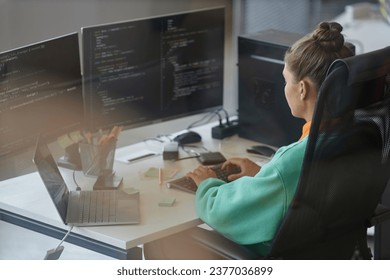 Woman working with security code on computer - Powered by Shutterstock