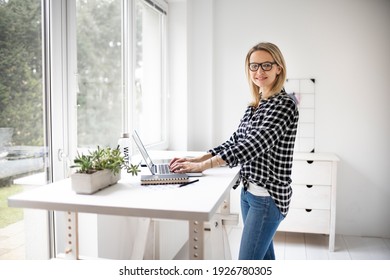 Woman Working At A Standing Desk In Office