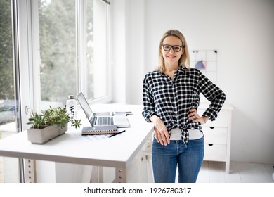 Woman Working At A Standing Desk In Office