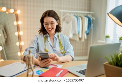 Woman is working at workshop. Concept of small business.                                                               - Shutterstock ID 1585700497