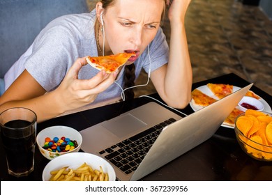 Woman works at the computer and eating fast food. Unhealthy Lifestyle - Shutterstock ID 367239956