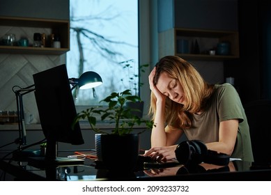 Woman Works Late At Home Workplace, Remote Work Concept. Burnout And Emotional Stress Due To Overworking