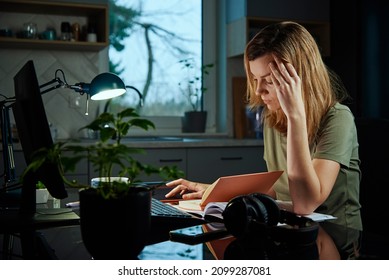 Woman Works Late At Home Workplace, Remote Work Concept. Burnout And Emotional Stress Due To Overworking