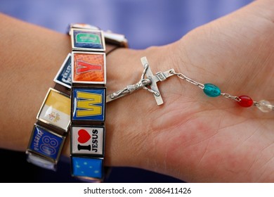 Woman With World Youth Day Bracelet Holding Rosary. Australia.  - Powered by Shutterstock