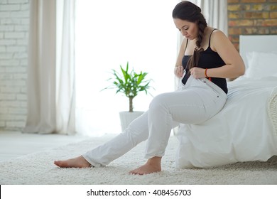 Woman  worried about weight gain. - Shutterstock ID 408456703