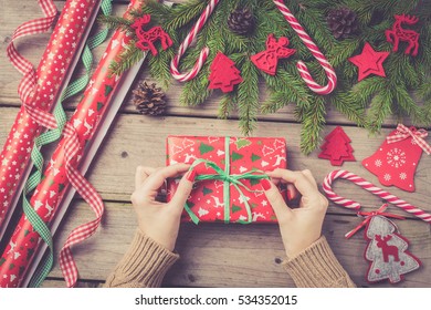 Woman Wrapping Christmas Present.