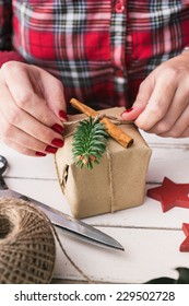 Woman Wrapping Cool Christmas Gift