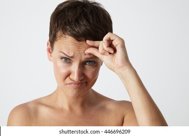 Woman With A Wrinkles On A Forehead