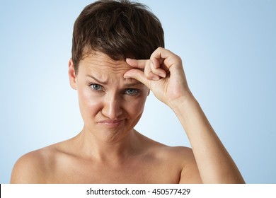 Woman With A Wrinkles On A Forehead