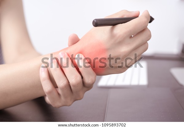 woman wrist arm pain long\
use pen mouse working. office syndrome healthcare and medicine\
concept