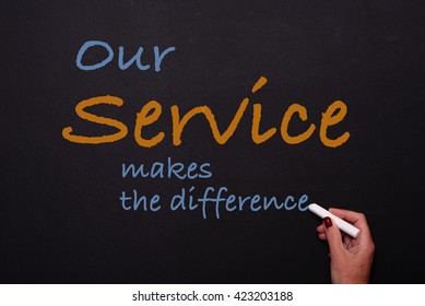 Woman Writes On Blackboard Our Service Makes The Difference