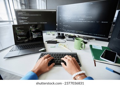 Woman writing computer codes for program - Powered by Shutterstock