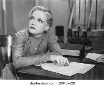 Woman Writing At Desk