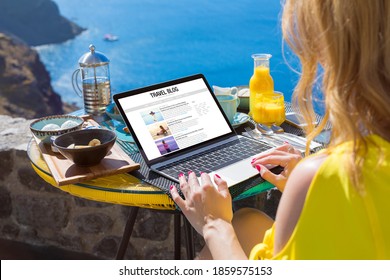 Woman Writing Her Travel Blog On Laptop