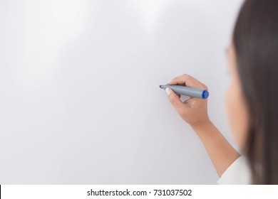 Woman Writing With A Marker On A Board