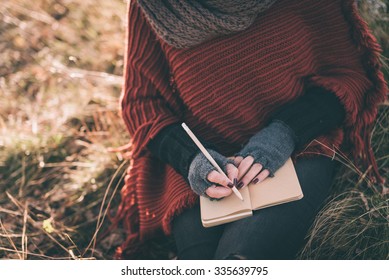 Woman Writing In The Notebook