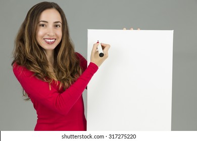 Woman Writing On A Marketing Board With A Marker