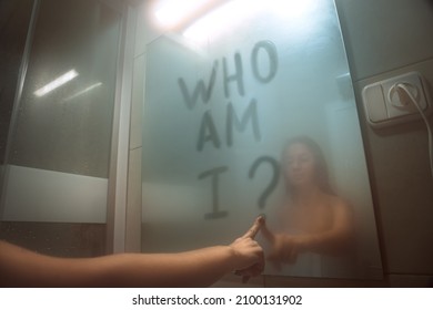 Woman Writing On The Mirror Who Am I. Self Awareness, Identity Or Personality Concept